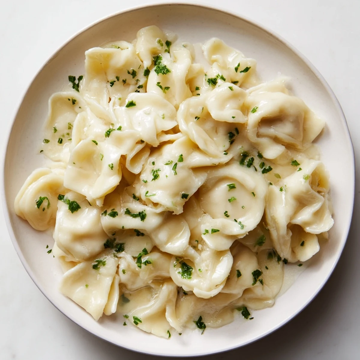 A photo showcasing a bowl of buttery spaetzle, a classic German egg noodle recipe, ready.
