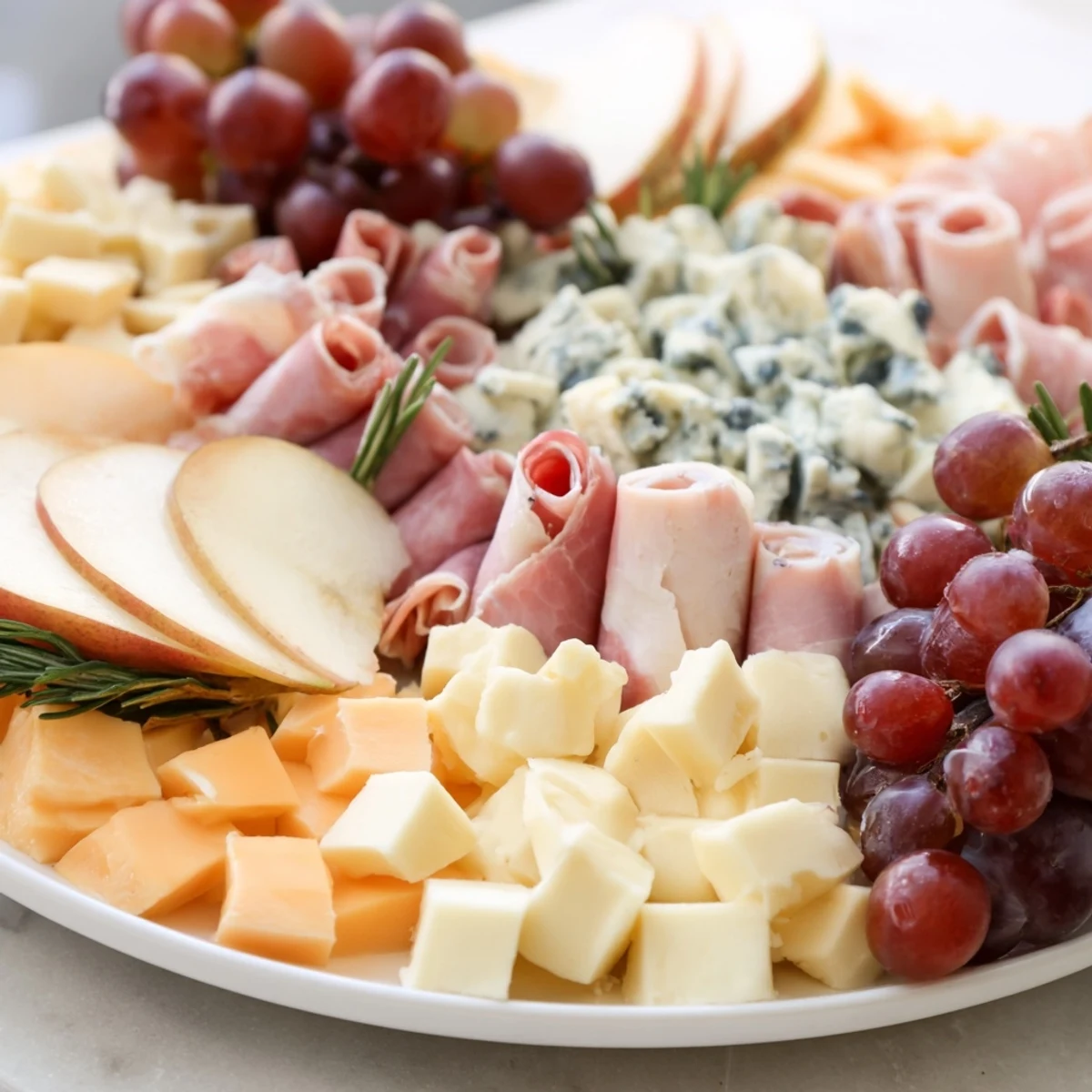 Beautifully arranged Sleigh Ride Charcuterie, brimming with artisan cheeses, cured meats, and fresh, colorful fruits.
