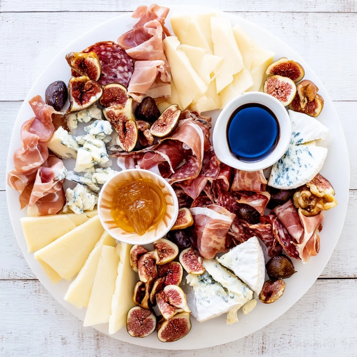 Close-up of a festive Plateau des Rois Mages Gourmand, showcasing holiday cheeses, meats, and delicious treats.