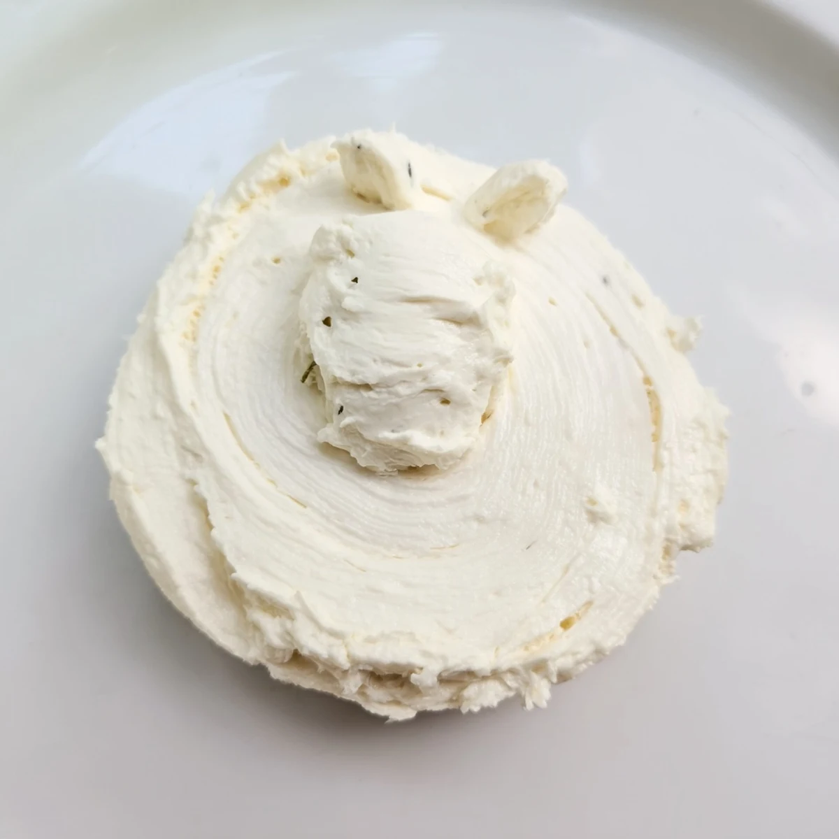 Polar Bear Iceberg Cracker Stacks topped with creamy cheese, olives, and capers on crispy crackers.