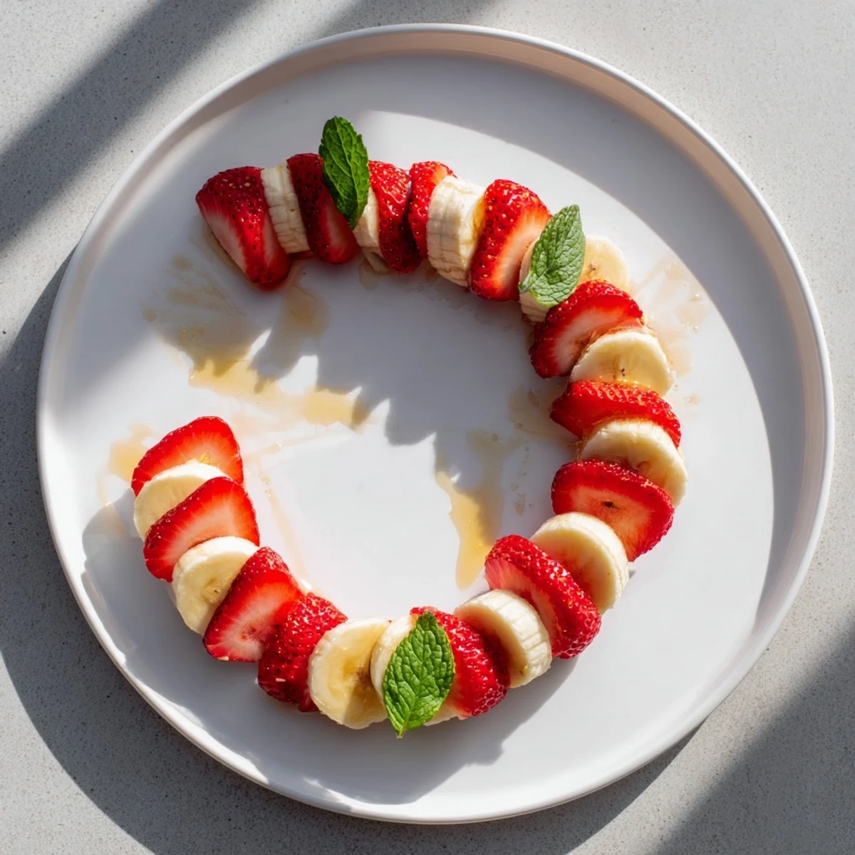 A plate of fresh Banana Strawberry Candy Cane: A cheerful holiday snack, beautifully arranged.