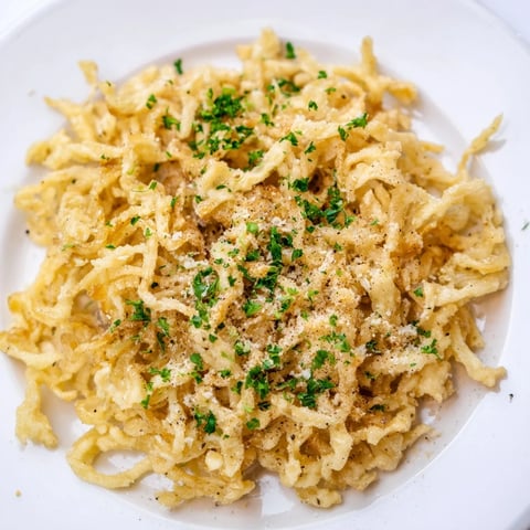 Golden-brown air fryer German spätzle, crispy edges inviting you to taste this simple side dish.