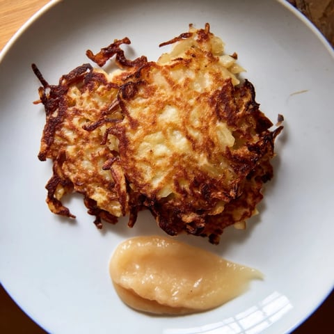 Golden-brown German potato pancakes sit ready to be enjoyed, a savory side dish.