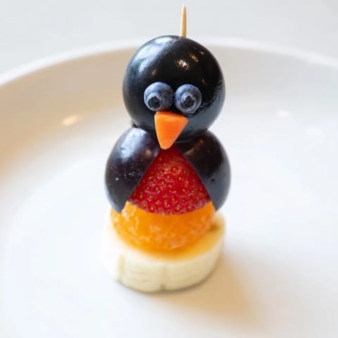Here are the three ALT texts for the "Penguin Fruit Skewer Army" recipe: