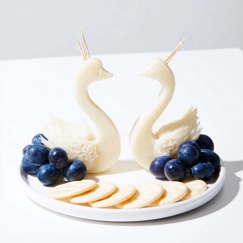 This Elegant Swan Lake Board presents a beautiful cheese and fruit appetizer perfect for entertaining.