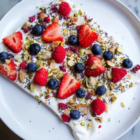 Enjoy this creamy frozen fruit yogurt bark with a variety of fresh or frozen summer fruits.