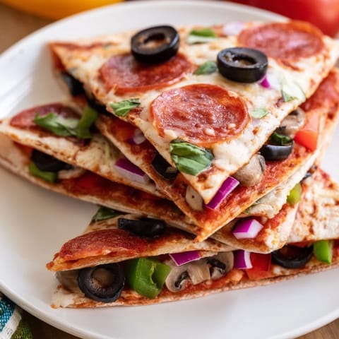 Golden-brown Tortilla Pizza Wrap with pepperoni, a quick and easy handheld pizza meal.