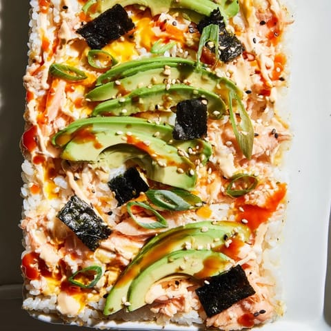 This colorful Sushi Bake Casserole, with flaked salmon and nori, is a perfect, easy weeknight meal.