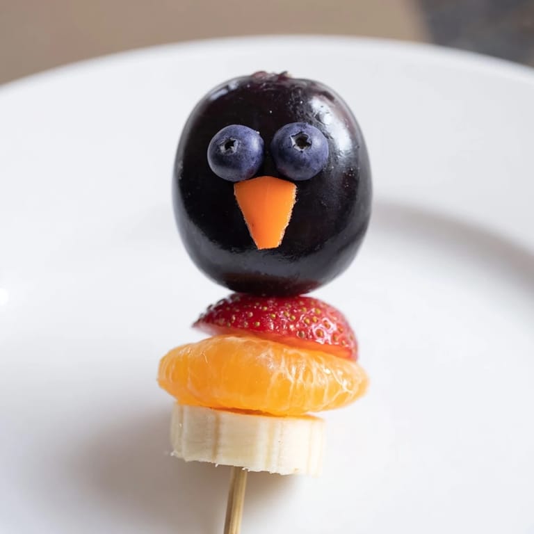 Vivid Penguin Fruit Skewer Army with colorful fruit; a fun, healthy snack ready to serve.