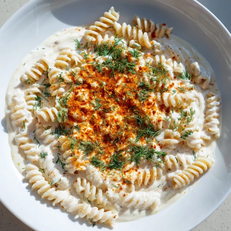 Close-up of Turkish Yogurt Pasta: A flavorful vegetarian meal with perfectly cooked pasta and vibrant spices.