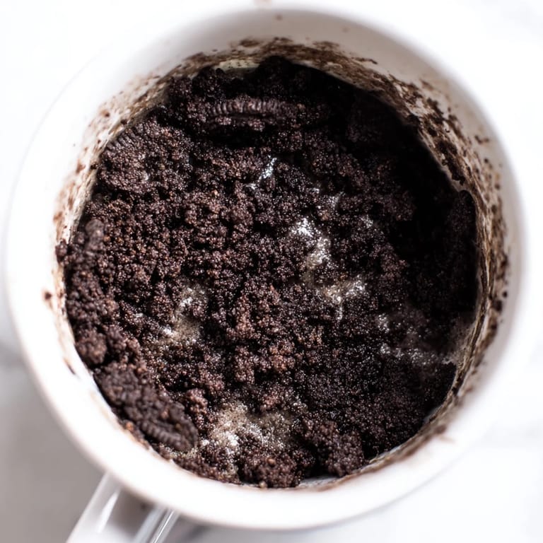Easy Oreo mug cake, a small, individual dessert—perfect for a fast, microwaveable snack.