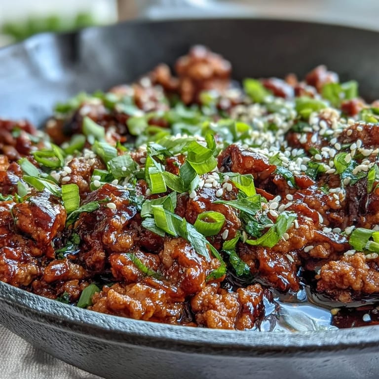 Sizzling Korean-Style Ground Turkey simmering in a glossy, spicy-sweet sauce with fresh garlic and ginger.